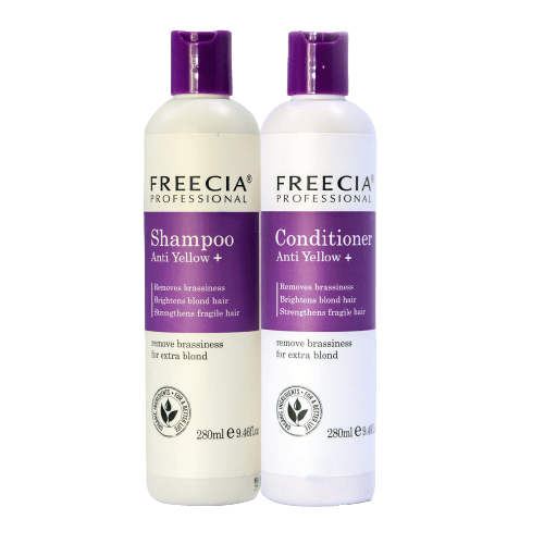 Two bottles of Freecia Professional Shampoo and Conditioner Anti Yellow on a white background